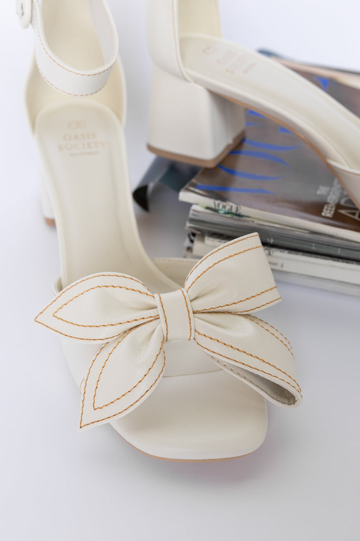 white bow toed heels