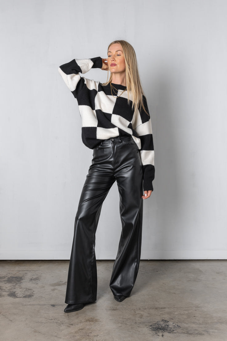 black checkerboard pattern sweater