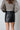 black faux leather white stitching mini skirt