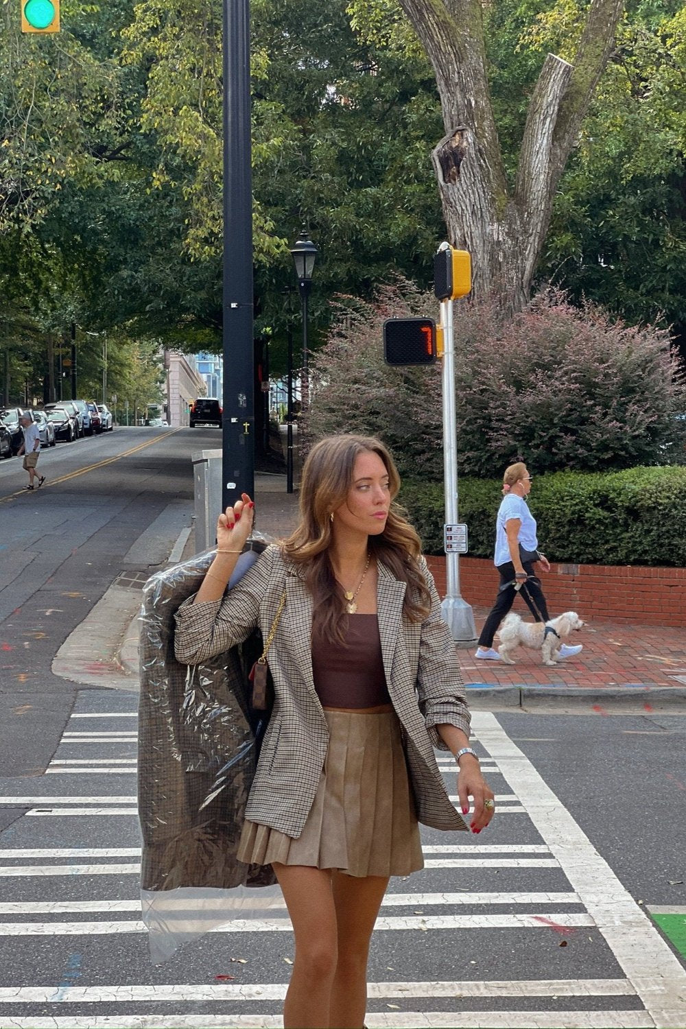 oversized brown plaid open blazer outfit with brown tank top and pleated brown mini skirt