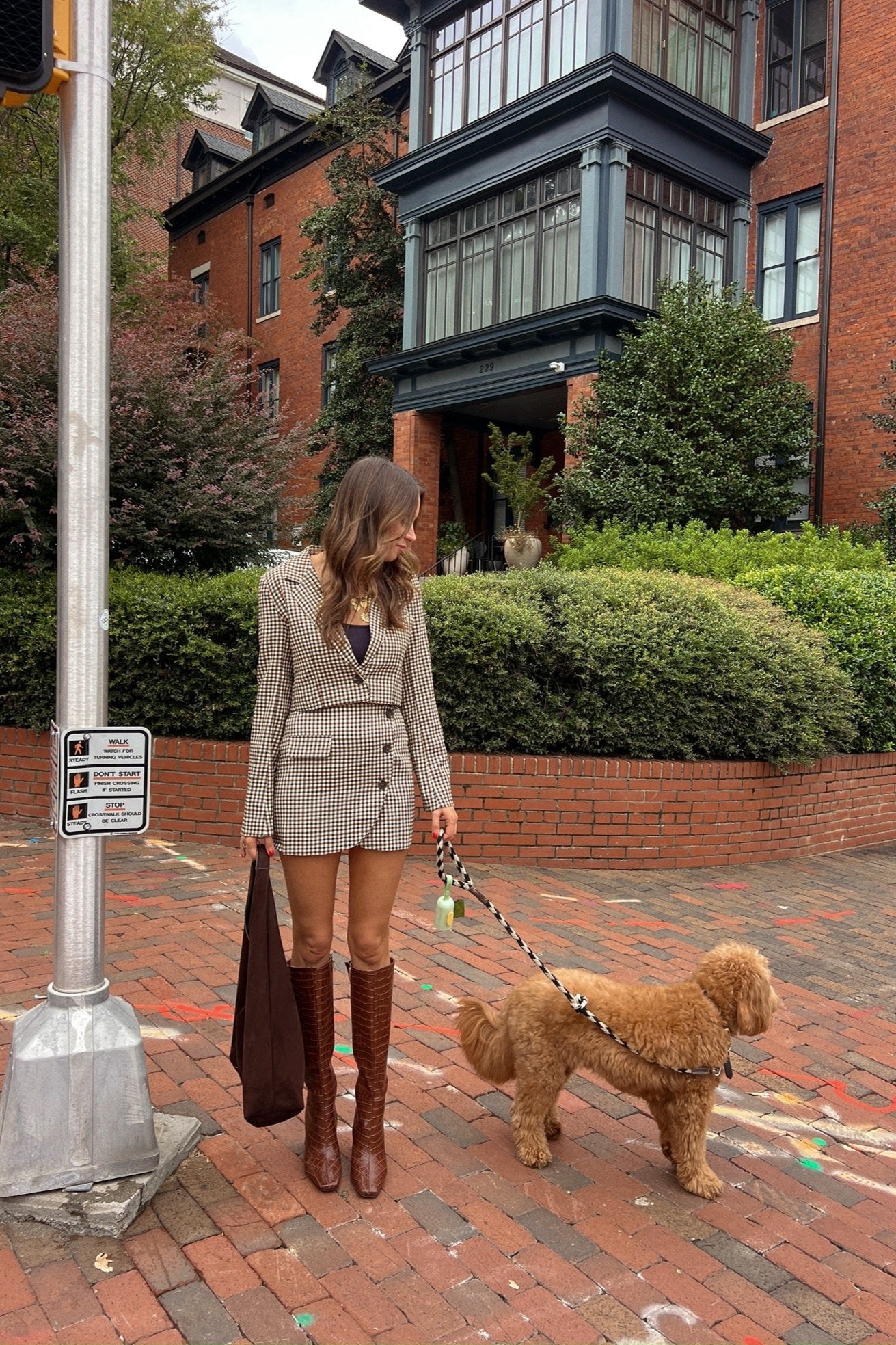 brown and black plaid set outfit with cropped structured blazer with a matching mini skort