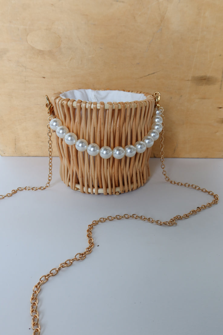 gold and pearl straw bag