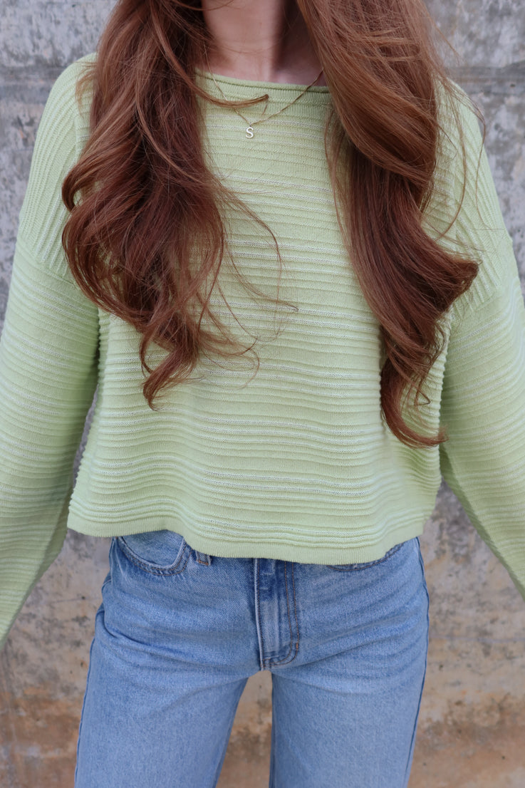 green textured sweater