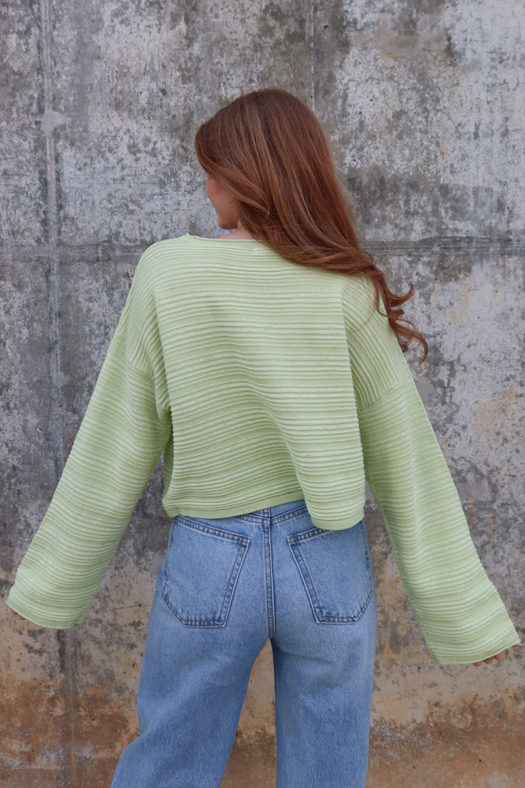 green textured sweater