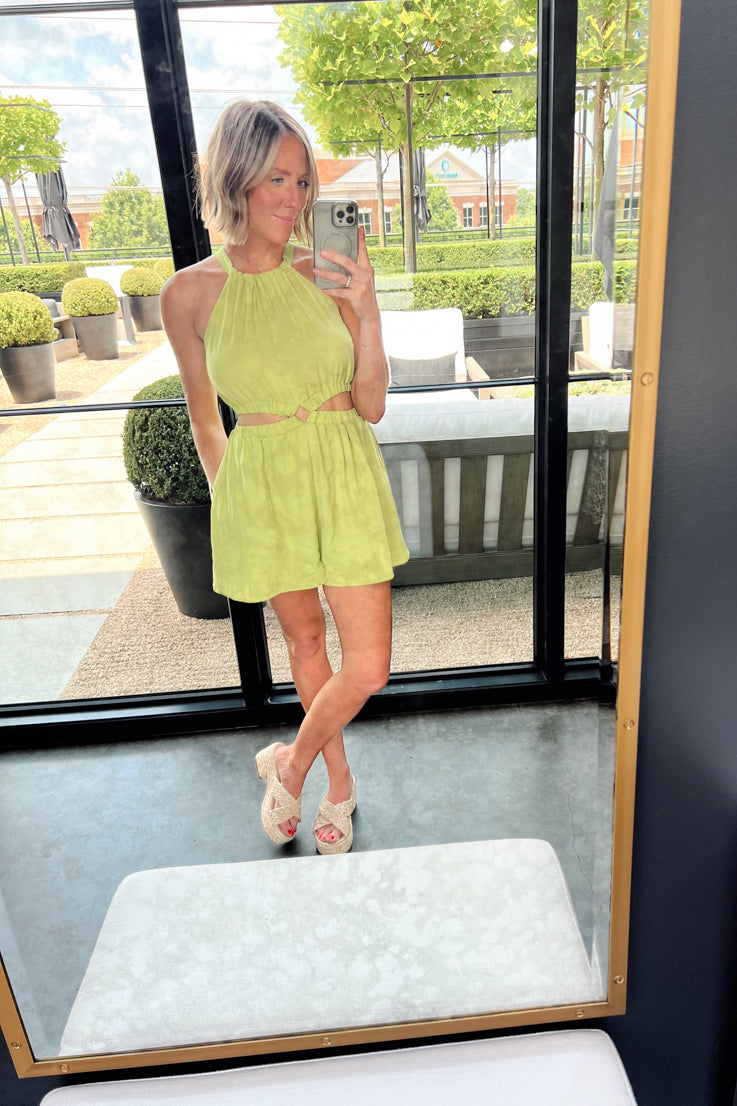 green romper with cut-outs