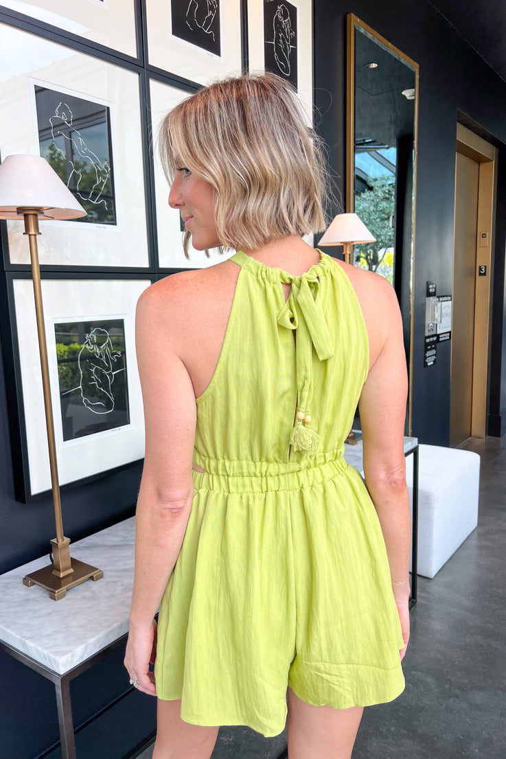 green romper with cut-outs