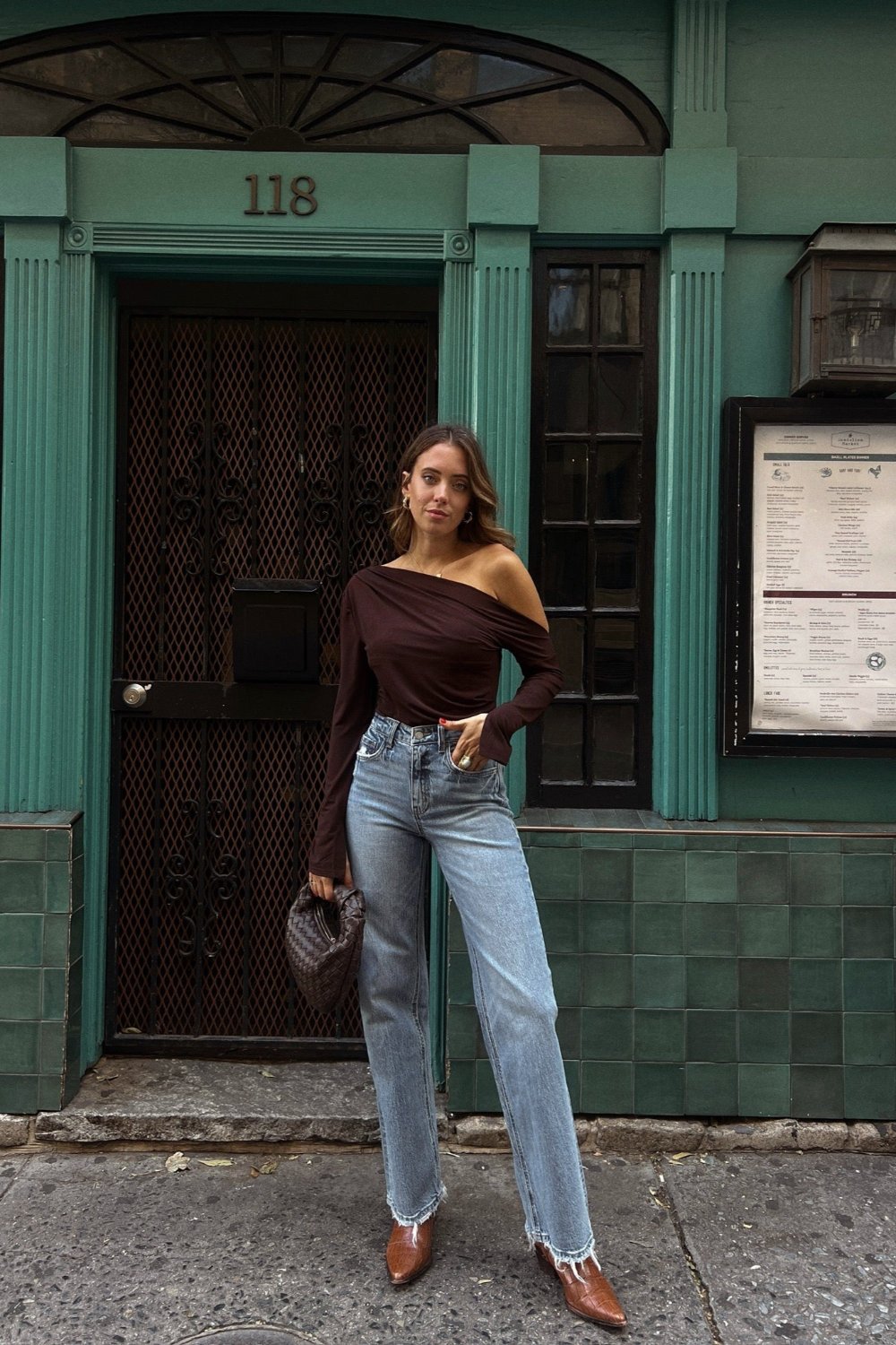 medium wash cutoff raw hem high waisted denim jeans and brown off shoulder bell sleeve top 