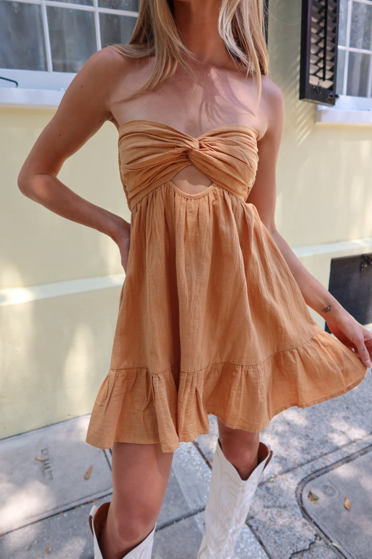 mustard double strap open back, a cute cutout beneath the bust, and a flowy dress overlay