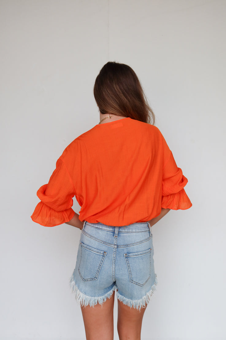 orange bodysuit 