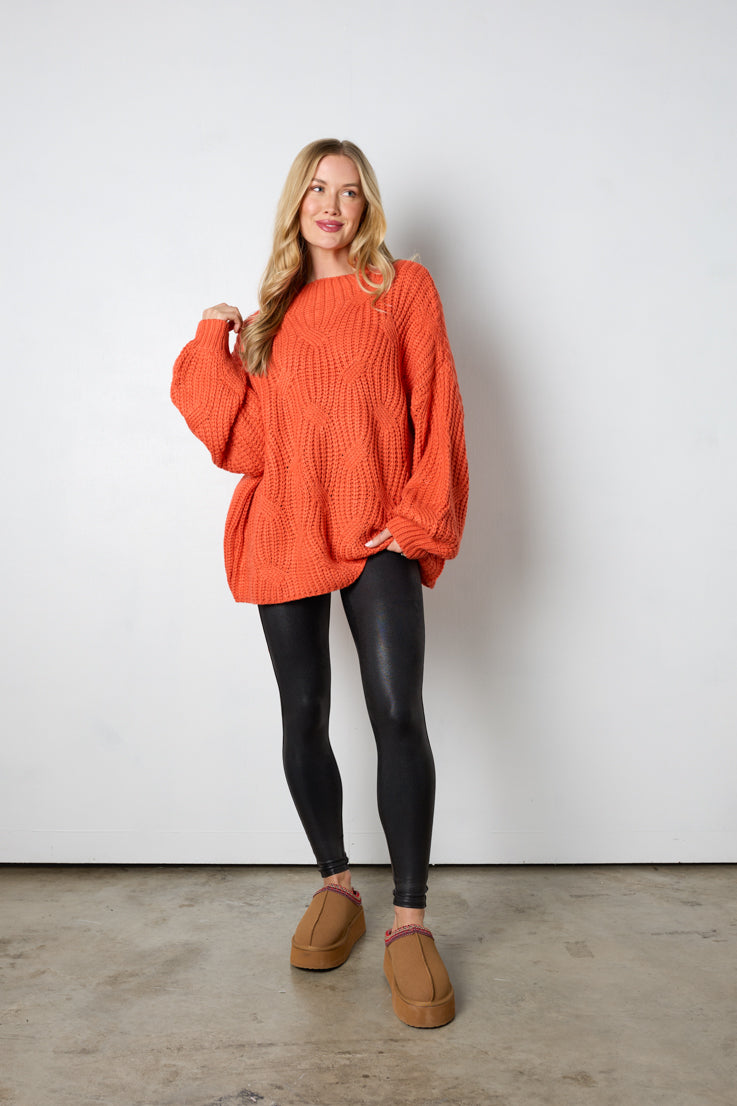 orange oversized cable knit sweater