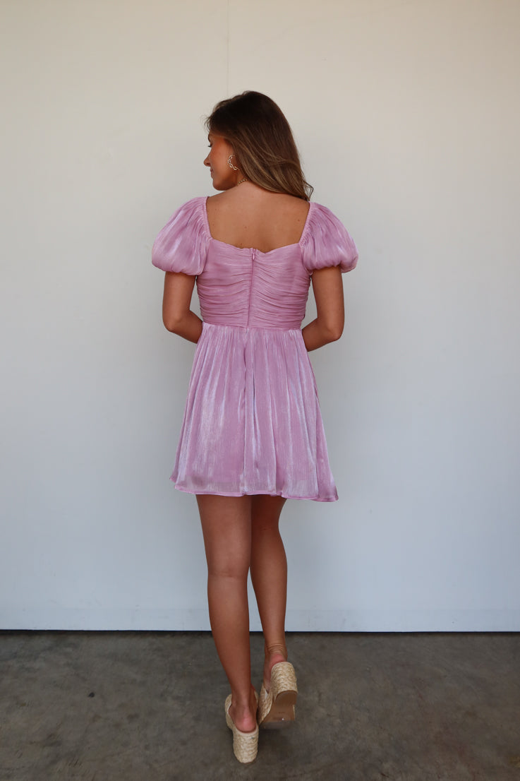 purple puff sleeve dress with bow details