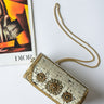 ivory tube bag with gold details