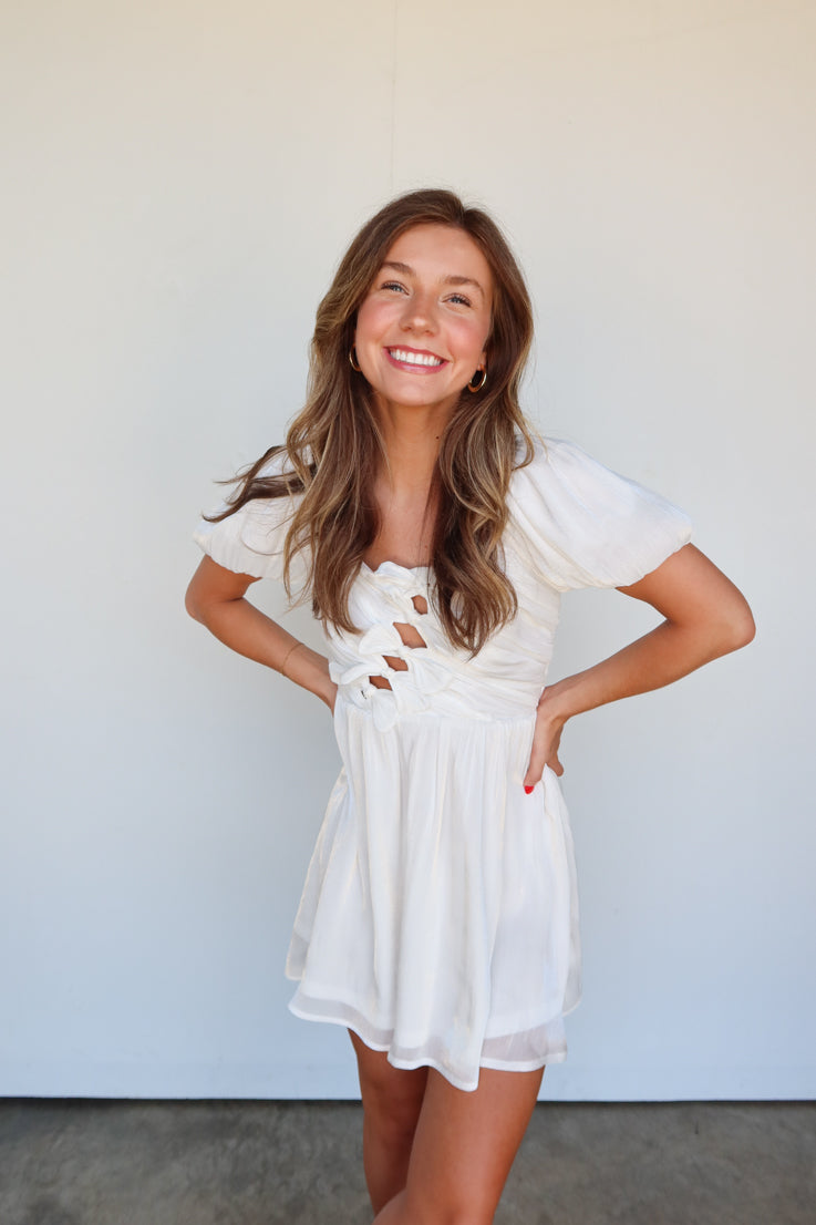 white puff sleeve dress with bow details