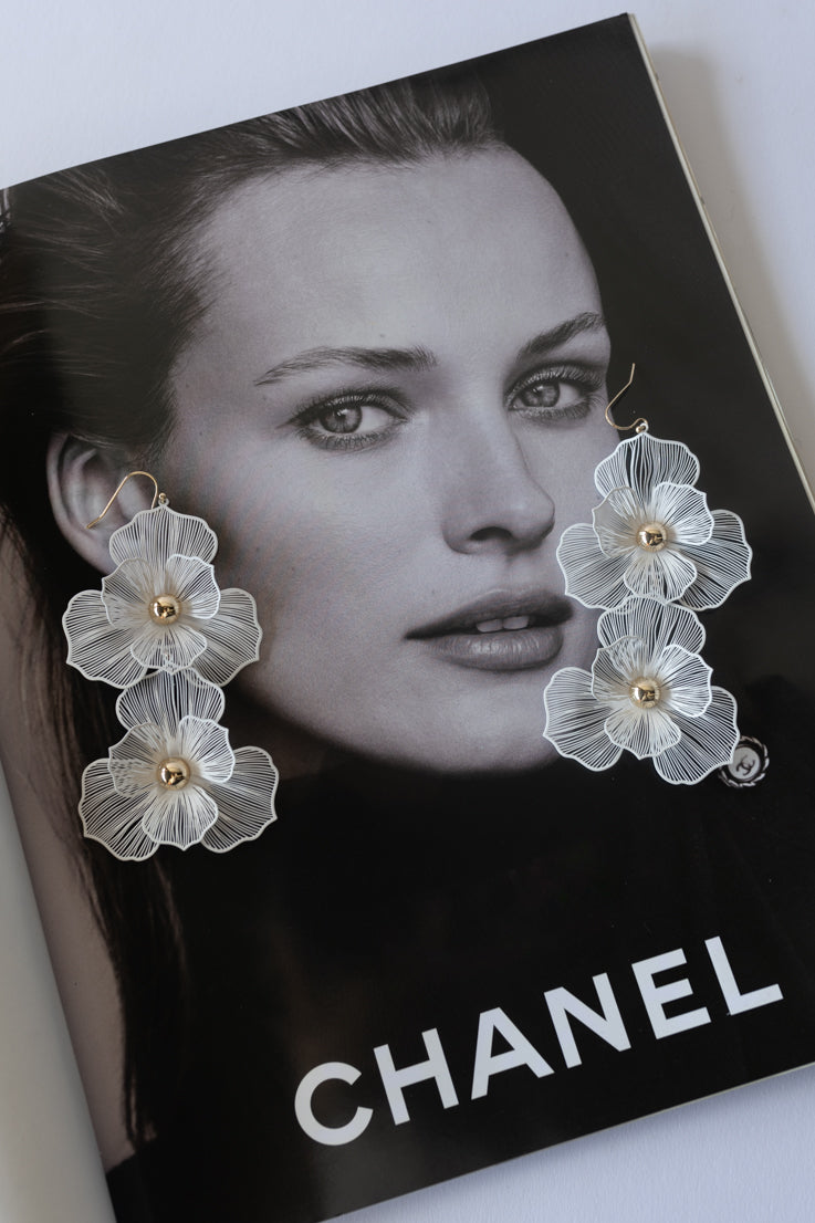 white floral dangly earrings