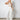 white jumpsuit lacey-floral halterneck bust