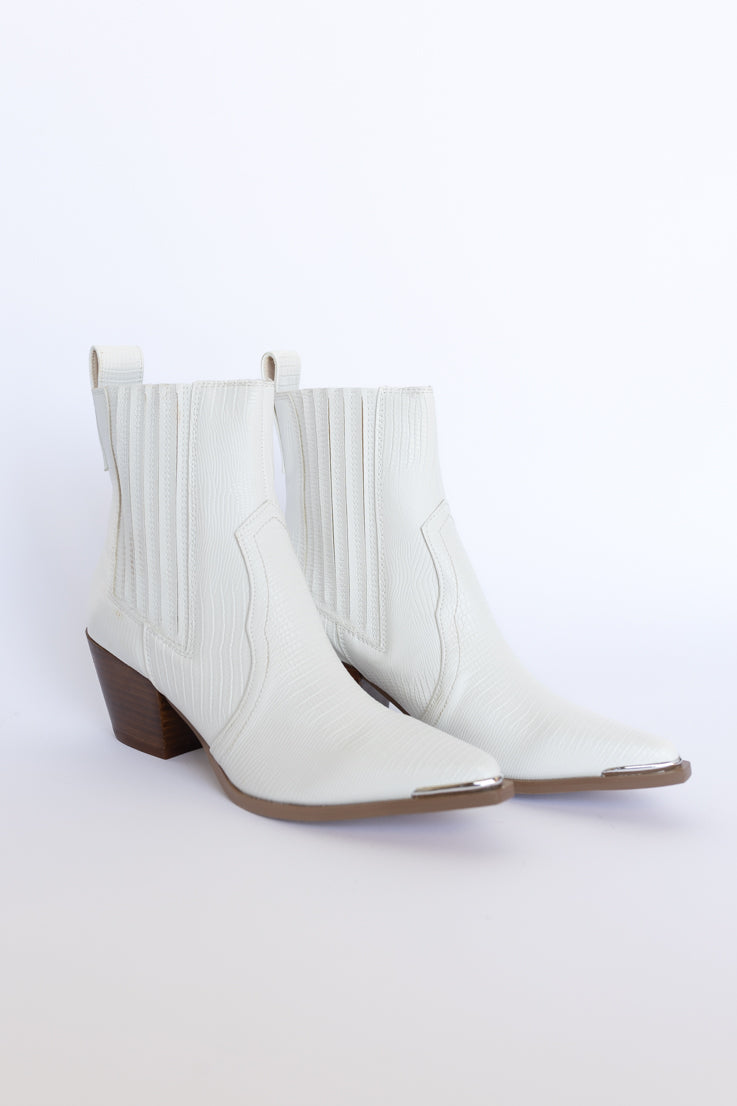 white snakeskin ankle booties