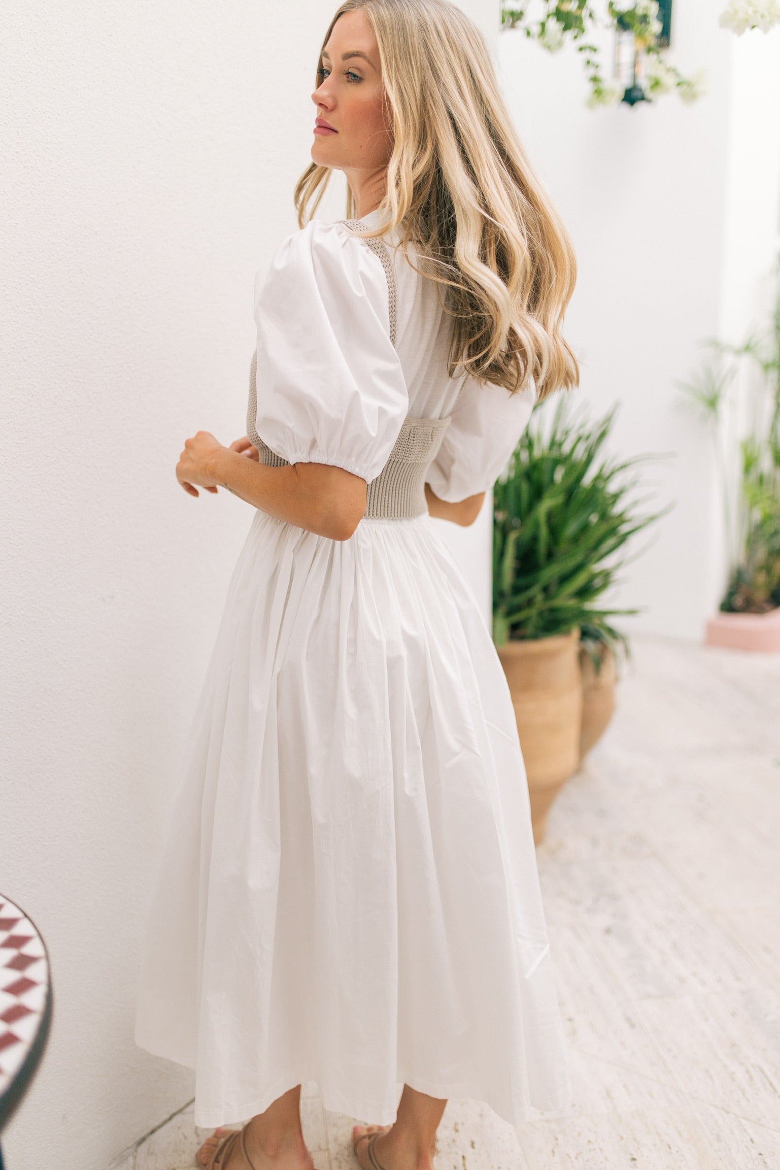 white flowy maxi dress with layered knit tank