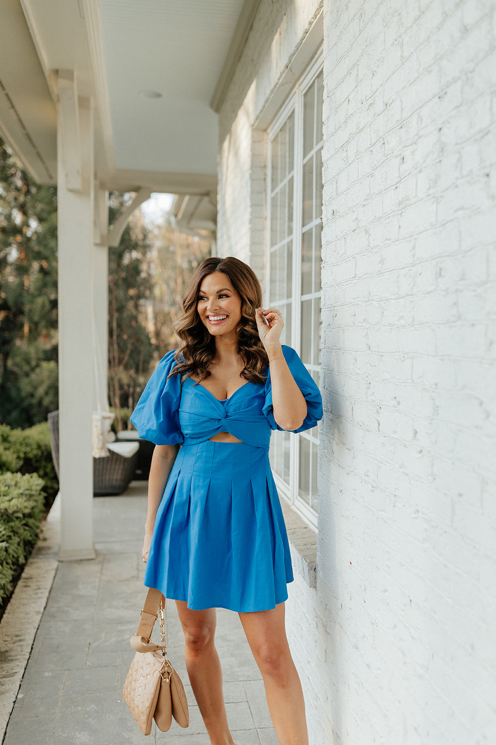 blue dress with pleats and puff sleeves