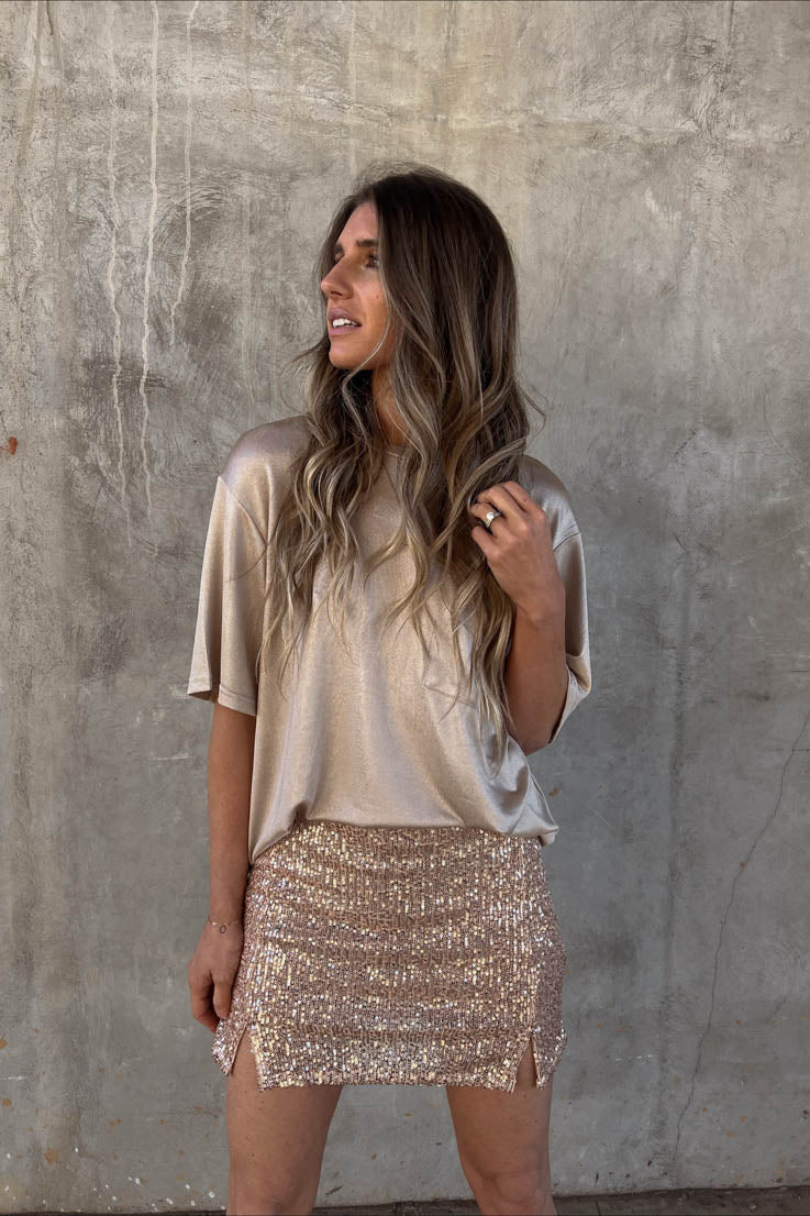 gold sequin glitter mini skirt with two small slits on the front