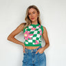 green checkered top with pink daisy