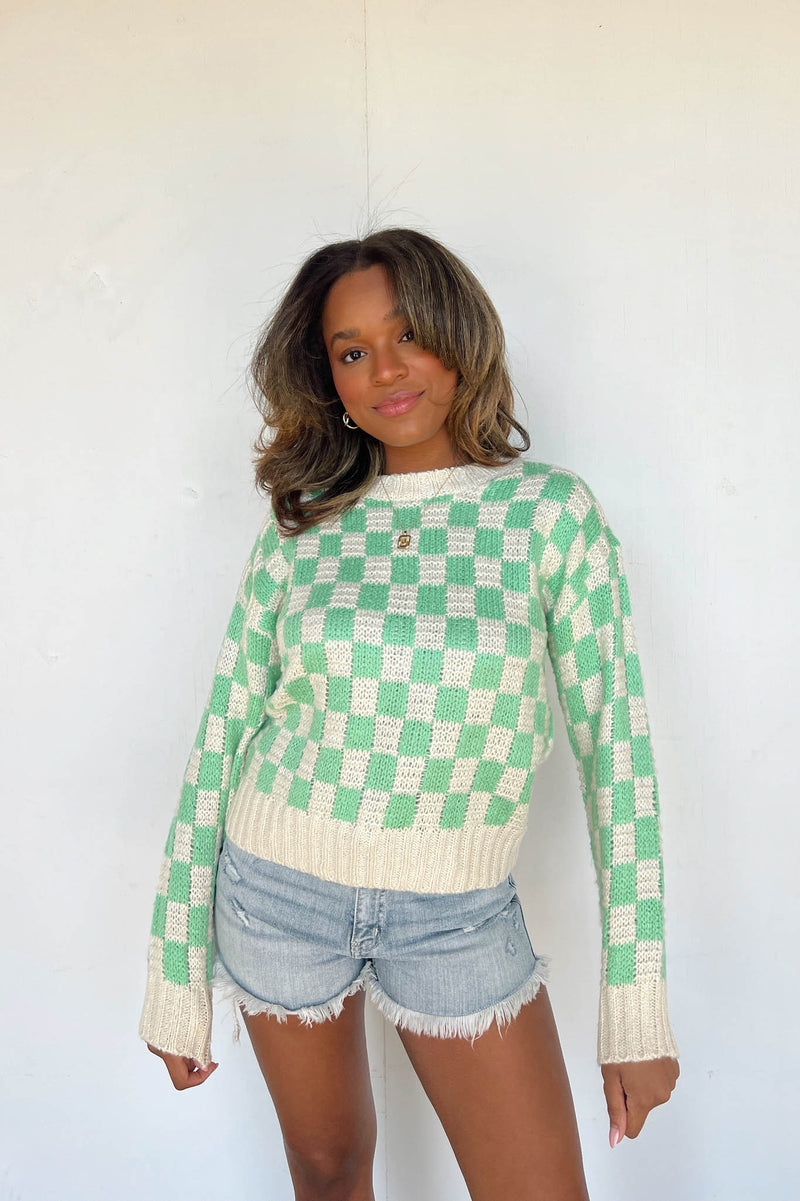 green and white checkerboard sweater