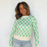 green and white checkerboard sweater