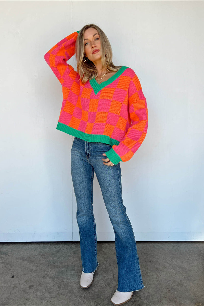 pink and orange checkered sweater green trim