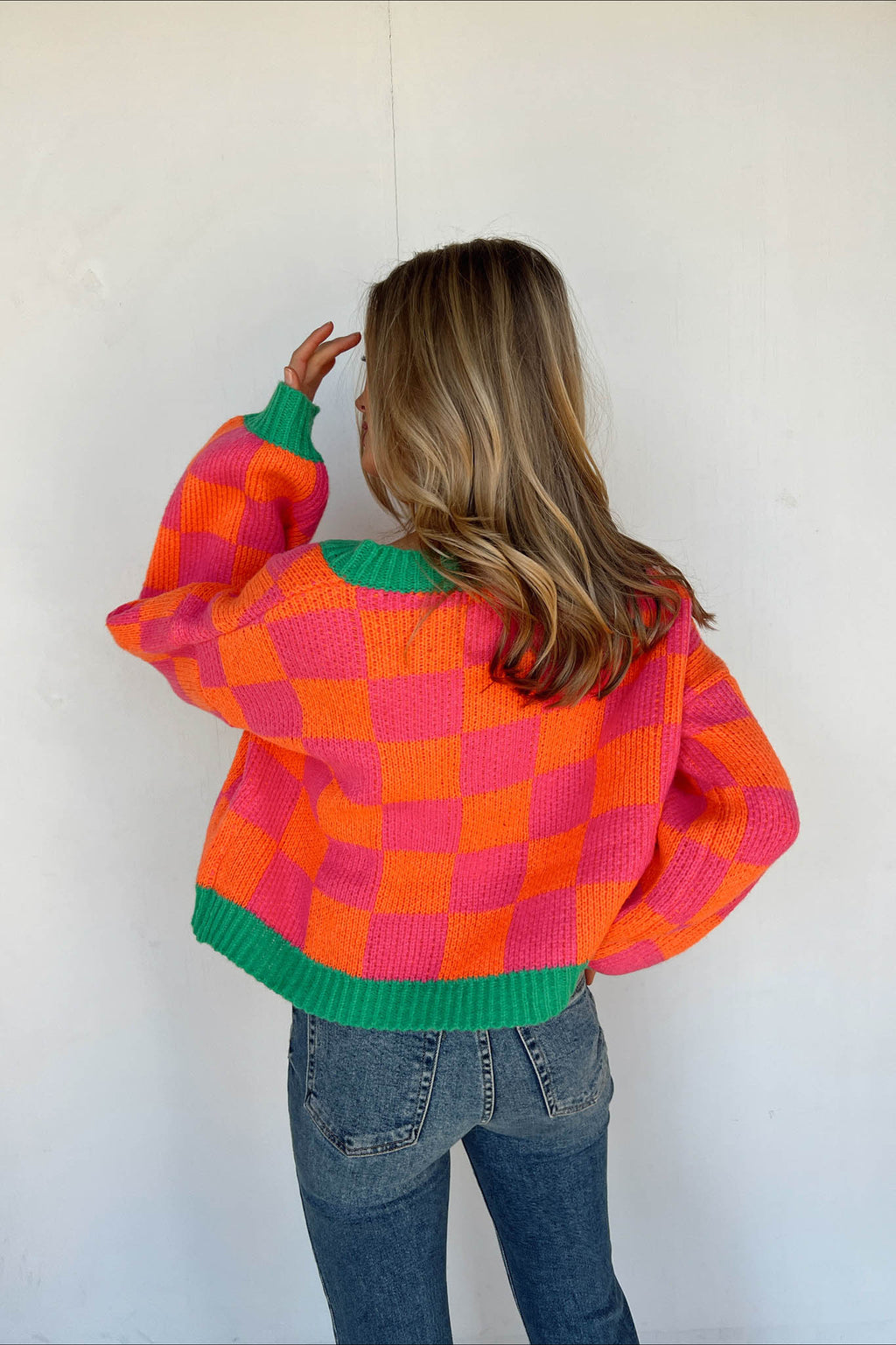pink and orange checkered sweater green trim