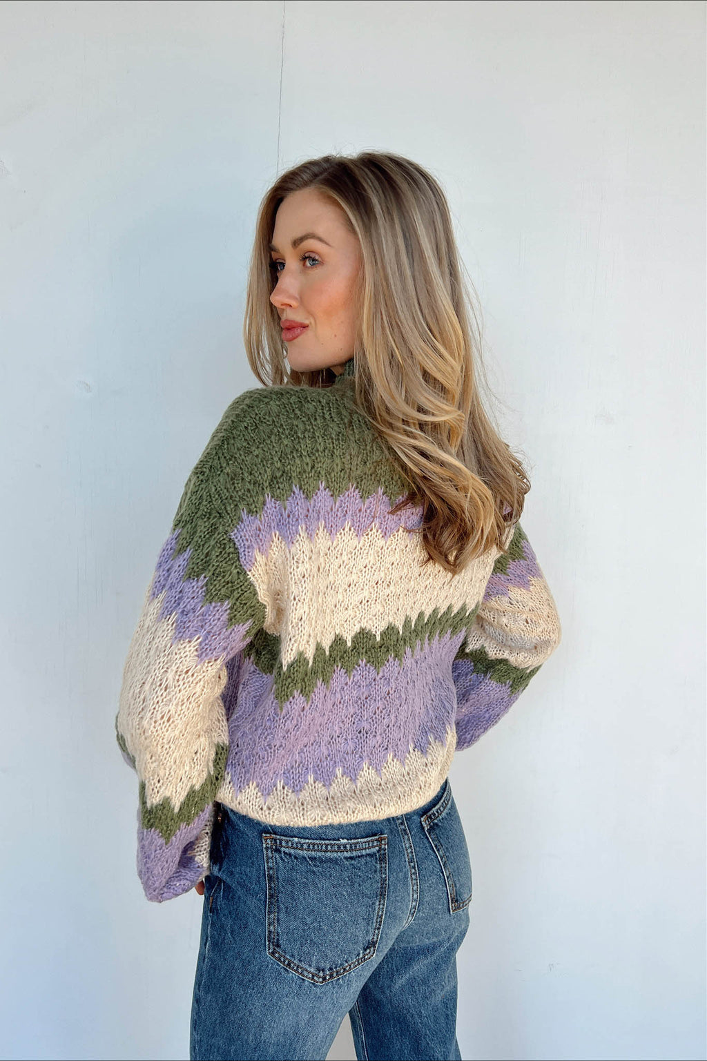 purple cream and green design sweater