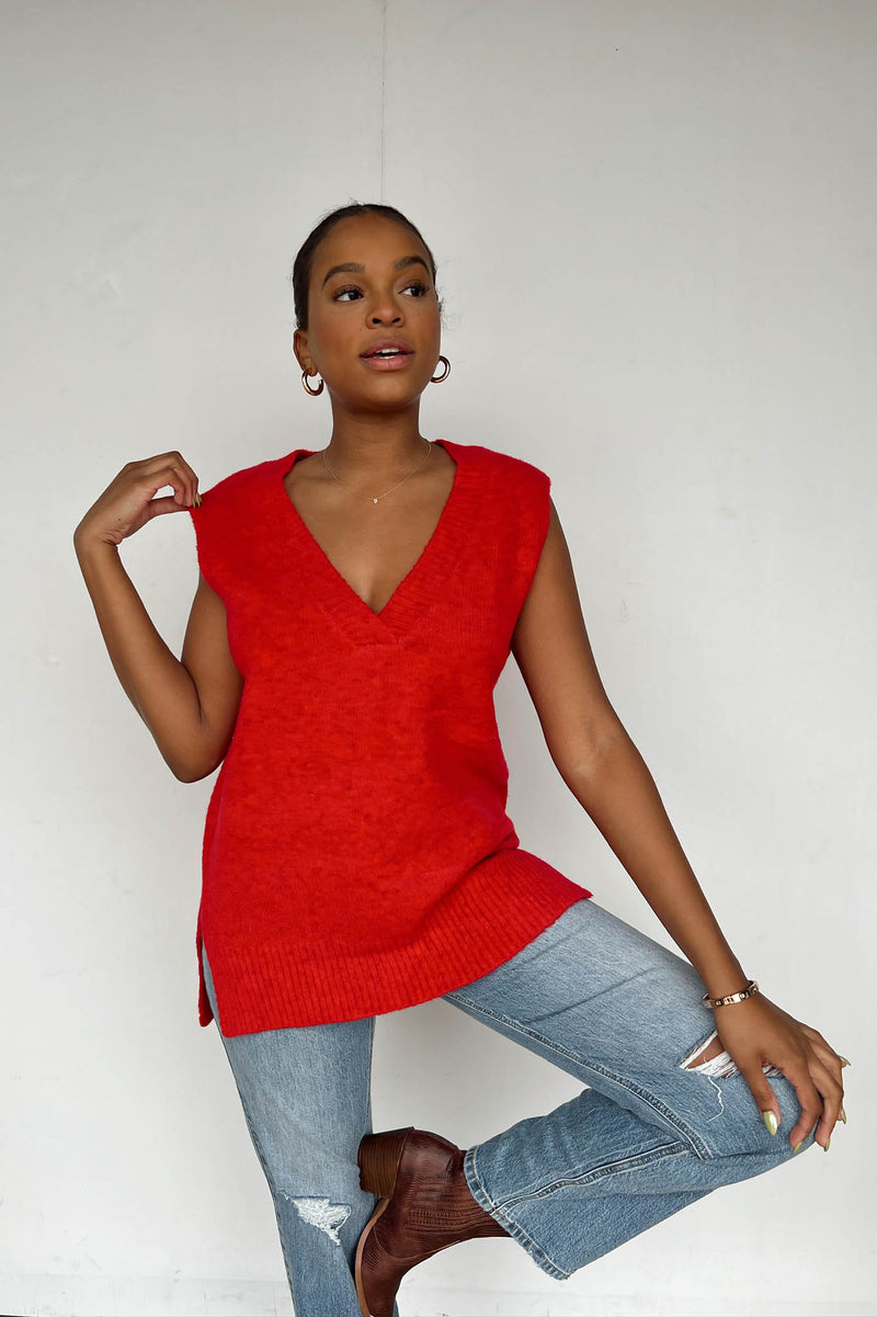 bold red v-neck sweater vest