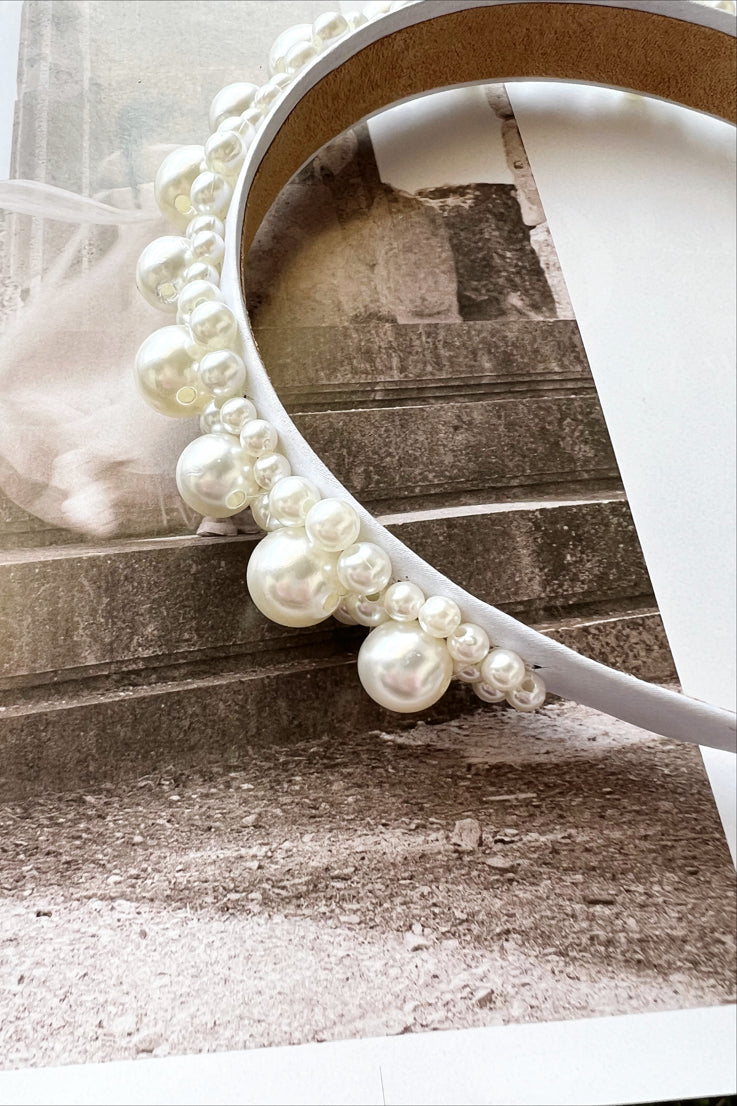 white headband with large and small pearls