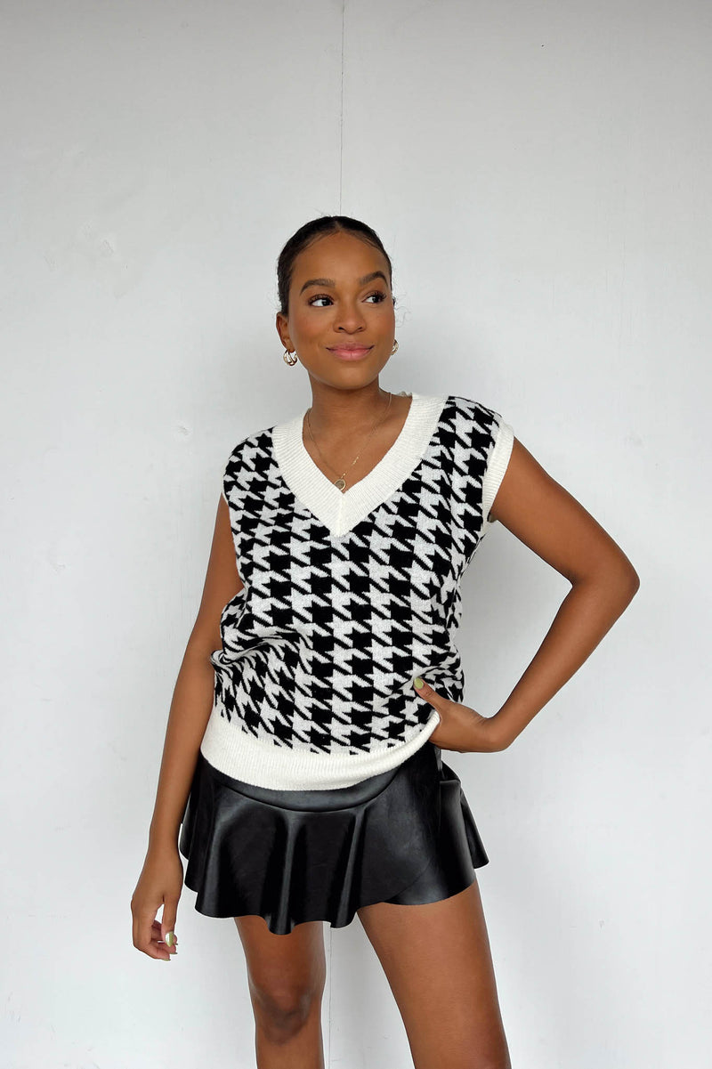 white and black houndstooth sweater-vest