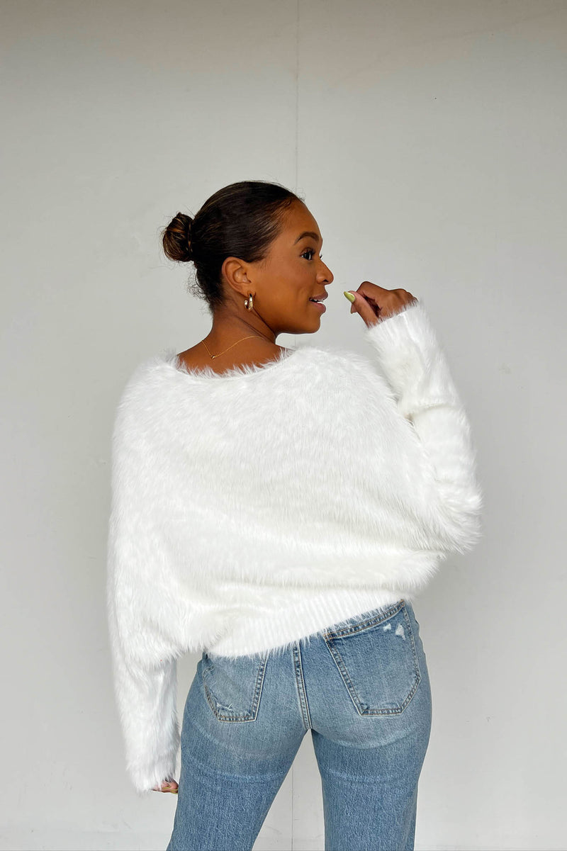 white fuzzy sweater 