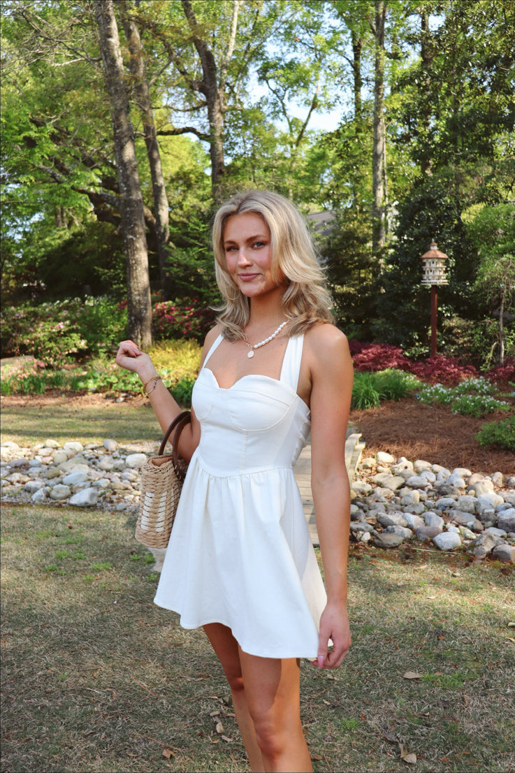 white mini dress with halter and sweetheart neckline
