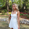 white mini dress with halter and sweetheart neckline