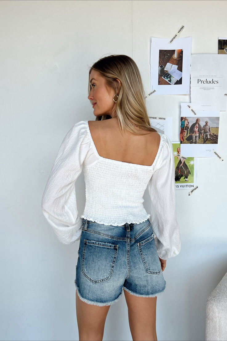 white long sleeve smocked top