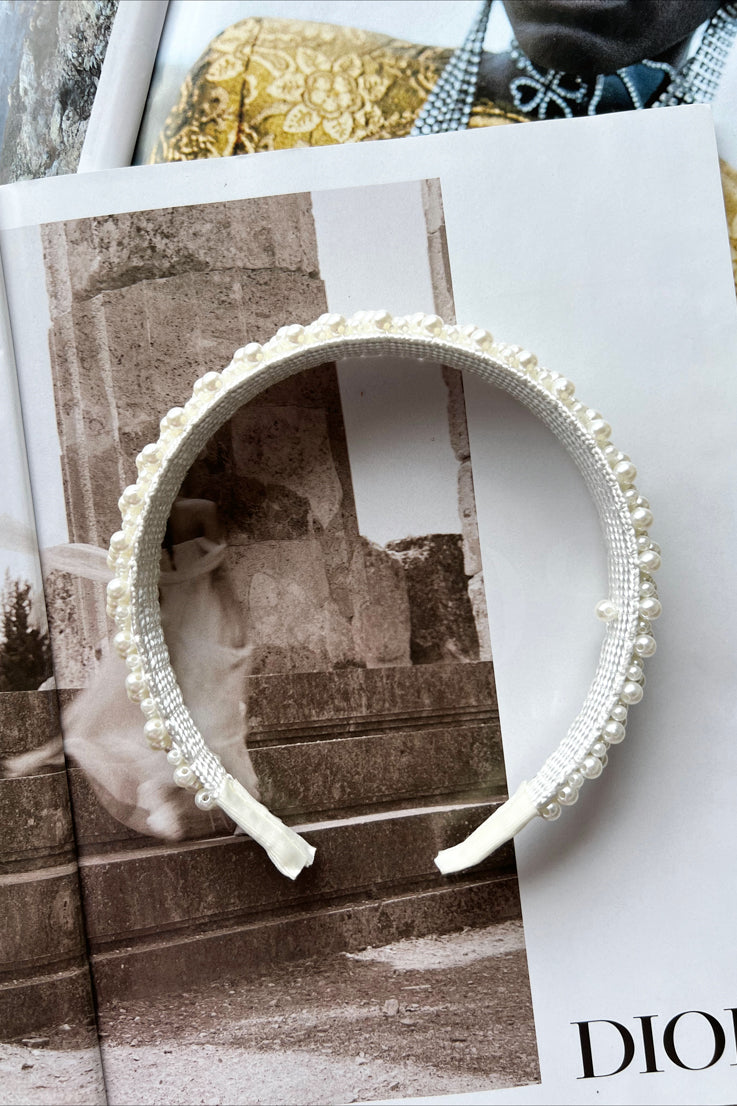 white headband with small pearls